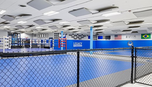 Modern Jiu-Jitsu training facility with mats and equipment at Legacy Academy.