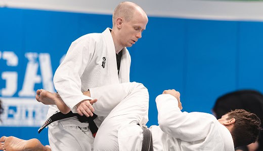 Brazilian Jiu-Jitsu practitioner executing a guard pass during training at Legacy Jiu-Jitsu Academy.
