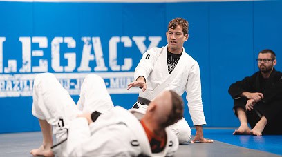 Jiu-Jitsu instructor demonstrating techniques to students at Legacy Jiu-Jitsu Academy.