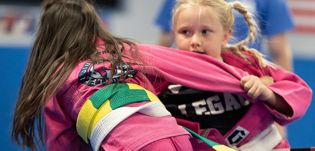 Young girls practicing Brazilian Jiu-Jitsu at Legacy Jiu-Jitsu Academy.