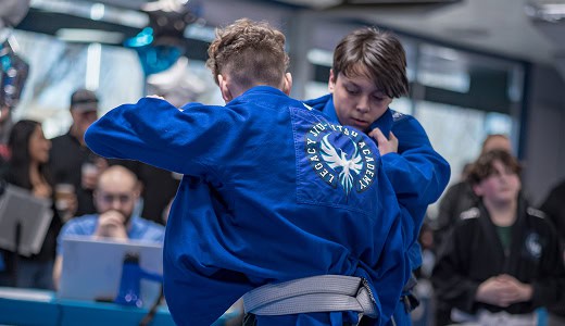 Teen martial arts students practicing Jiu-Jitsu techniques at Legacy Jiu-Jitsu Academy.